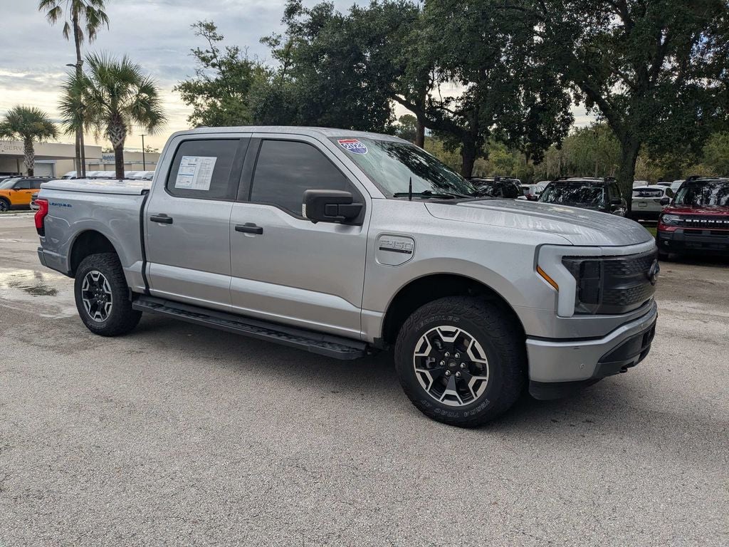 Used 2023 Ford F-150 Lightning XLT with VIN 1FTVW1EL1PWG30243 for sale in Palm Coast, FL