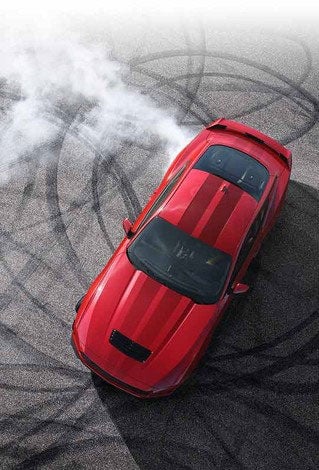 Overhead view of a 2024 Ford Mustang® model with tire tracks on pavement | Palm Coast Ford in Palm Coast FL