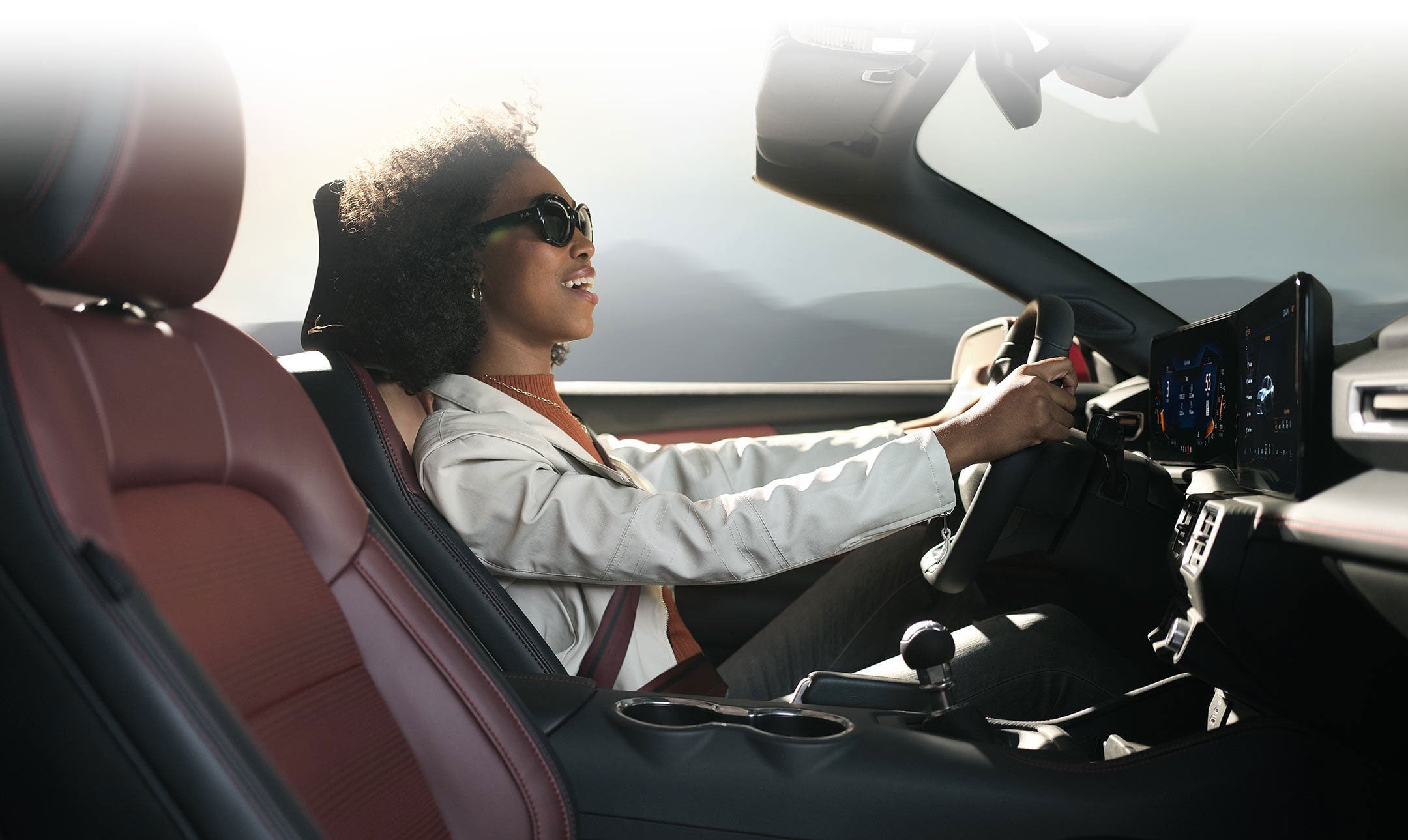 Person sitting in the driver’s seat of a 2024 Ford Mustang® convertible | Palm Coast Ford in Palm Coast FL