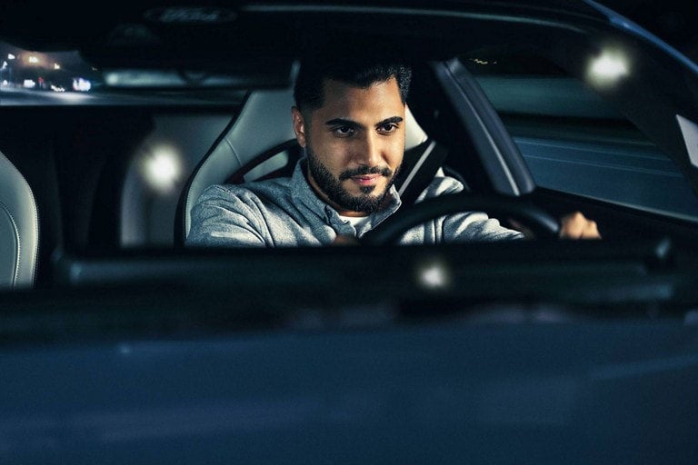 Person sitting in the driver’s seat of a parked 2024 Ford Mustang® coupe | Palm Coast Ford in Palm Coast FL